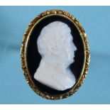 A carved hardstone cameo ring, decorated a bust of a gentleman, a yellow coloured metal mount,
