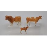 A Beswick Guernsey Bull, 1451, a Guernsey Cow, 1248B, and a Guernsey Calf, 1249A, all gloss (3)