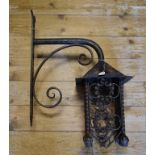 A wrought iron lantern, with a wall bracket, 22 cm wide