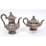 A William IV silver teapot, crested and with a presentation inscription, embossed flowers and