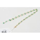 An 18ct gold and emerald bead necklace Report by NG Approx. 4.0 g (all in)