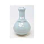 A Chinese Celadon ground vase of baluster form, moulded lotus leaves, six character mark in