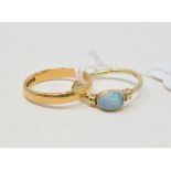 A 22ct gold wedding band, approx. ring size MÂ½, approx. 2.9 g, and a 9ct gold and opal ring,