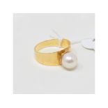 An 18ct gold and pearl ring, approx. ring size N Report by NG It is approx. 3.6 g (all in)