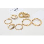 A pair of 9ct gold and diamond hoop earrings, a similar pair, and two 9ct gold pairs of earrings,