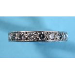 A diamond eternity ring, in a white coloured metal setting, approx. ring size PÂ½ See illustration