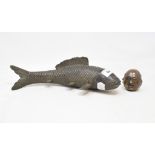 A bronze fish, 8.5 cm high, and a bronze desk weight, in the form of four faces, 5.5 cm high (2)