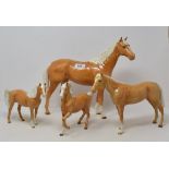 A Beswick Large Hunter, 2nd version, palomino, 1734, and three other palomino horses, 701, back legs