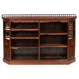 A late Victorian walnut open bookcase, having open shelves flanked by panel doors and mirrored