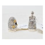 A novelty silver pincushion/thimble, in the form of a beehive, and another similar (2)
