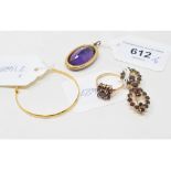 A 19th century amethyst and seed pearl pendant, a yellow coloured metal bangle, a 14ct gold and