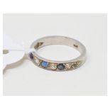 A platinum, diamond and sapphire half hoop ring, approx. ring size N Report by RB Approx. 4.6 g
