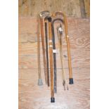 A Malacca walking cane, four others and four barbed arrows (9)