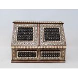 An Eastern bone and mother of pearl inlaid stationery box, with Mashrabiya panels, 28 cm wide