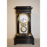 A late 19th century French portico clock, with 9.5 cm diameter enamel dial with Roman numerals,