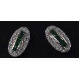 A pair of 9ct gold, emerald and diamond stud earrings Report by NG Modern