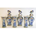 A garniture of six Delft polychrome vases, three with bird mounted covers, decorated figures and