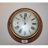 A brass bulkhead clock, with painted Roman numeral dial, 18 cm diameter