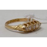 An 18ct gold and five stone diamond ring, approx. ring size L½ Report by NG It is approx. 2.4 g (all