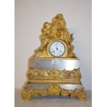 A 19th century French mantel clock, the 7.5 cm diameter enamel dial with Roman numerals, in a