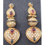 A pair of yellow coloured metal gem set drop earrings, with sapphire and ruby cabochons, brilliant