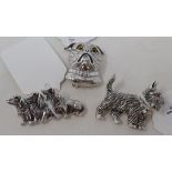 A novelty silver brooch, in the form of a terrier, and two others similar (3) Report by NG Modern