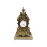 A 19th century mantel clock, the 10 cm diameter white enamel dial with Roman numerals, fitted a