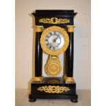 A late 19th century French portico clock, the 8.5 cm diameter silvered dial with Roman numerals,