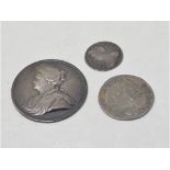 A Queen Anne shilling, 1714, a 4d, 1710, and a Queen Anne silver medallion, 1713 (3)