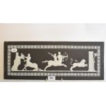 A Wedgwood black basalt Jasperware plaque, Teaching Achilles the art of war, 19.5 x 51 cm Report