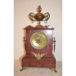 A late 19th century mantel clock, the 8.5 cm brass dial with Arabic numerals, fitted an eight day