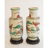 A pair of Chinese crackle glaze vases, decorated warriors, on clear cardboard stands, 23 cm high (2)