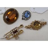 A 9ct gold, citrine and white sapphire brooch, and four other brooches (5)