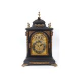 A musical bracket clock, the 19 cm arched square brass dial signed NOBLE & CHIVERS, BATH, the