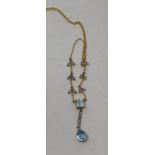 A 9ct gold, silver, blue topaz and diamond necklace Report by NG Modern