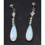 A pair of 9ct gold, opal and diamond drop earrings Report by NG Modern