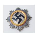 A German WWII type cross in gold, dated 1941 in the wreath, no other marks and maker unknown, 6.5 cm