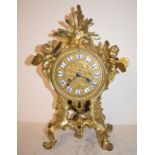 A Continental ormolu clock, decorated cherubs, 22 cm wide Key and pendulum