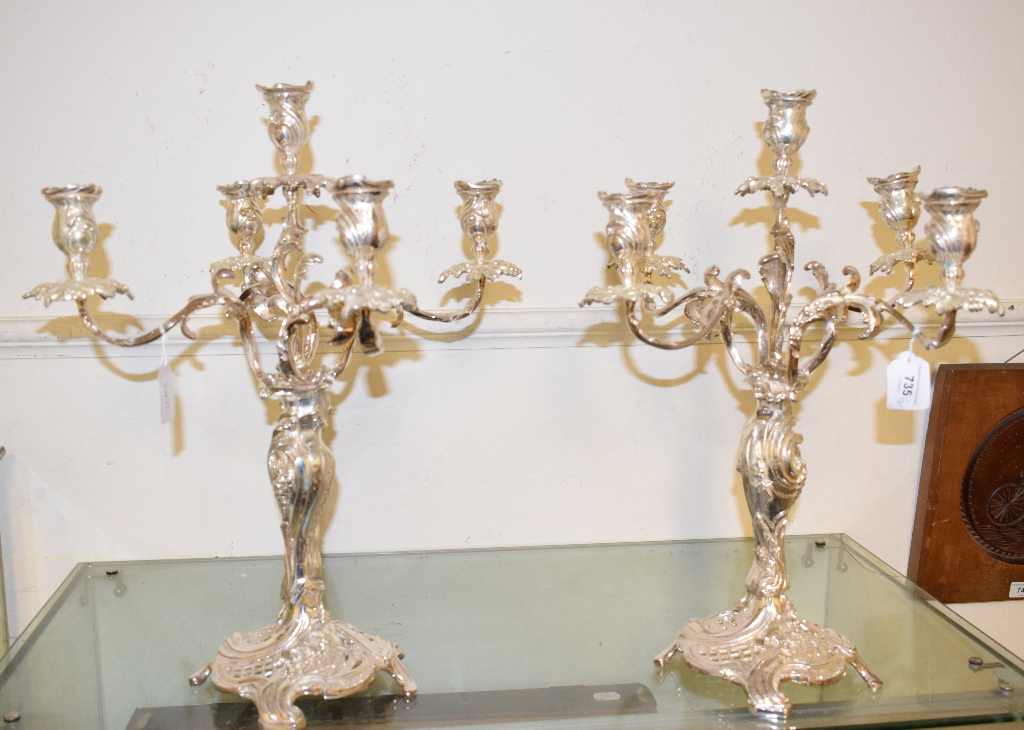 A pair of plated Rococo style five light candelabra, 48 cm high (2) Report by RB Modern
