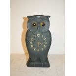 A timepiece, in a carved wood owl case, 25 cm high Modern