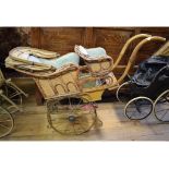 A late Victorian/early Edwardian double pram, with wicker basket and bentwood handles