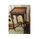 An Edwardian mahogany table, with pierced and blind fret carved decoration, 41.5 cm wide