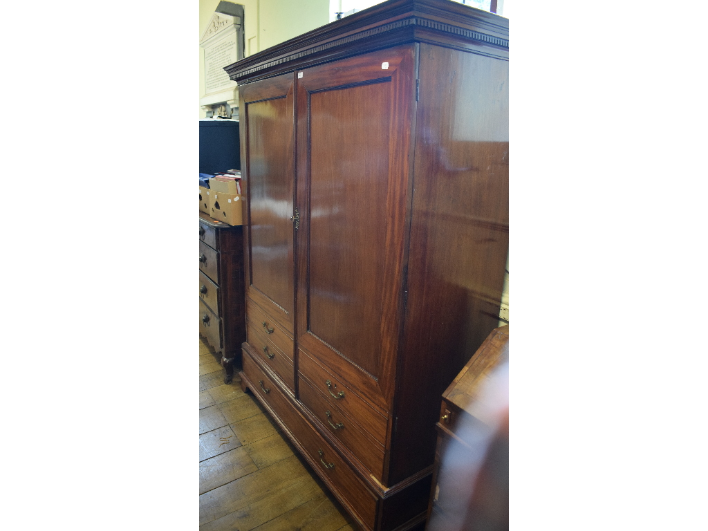 A mahogany wardrobe, adapted from a linen press, with a drawer below, 151 cm wide