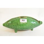 An earthenware money bank, in the form of a pig, with a green glaze, 25 cm long