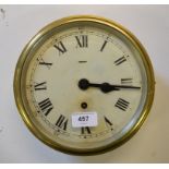 A bulkhead clock, the 18 cm diameter painted dial with Roman numerals, in a brass case, 25 cm