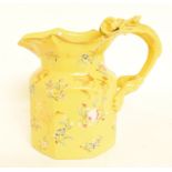 A Mason's Ironstone jug, decorated flowers on a yellow ground, handle restored, 18 cm high, a pair