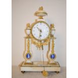A 19th century French mantel clock, the 9 cm diameter enamel dial with Arabic numerals, fitted an