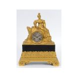 A 19th century French mantel clock, the 7 cm diameter silvered dial with Roman numerals, fitted an