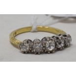 A five stone diamond ring, on a yellow coloured metal shank, approx. ring size O See illustration