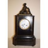 A late 19th/early 20th century mantel clock, the 9.5 cm diameter enamel dial with Roman numerals,